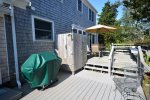Grill area opening into large porch with plenty of seating
